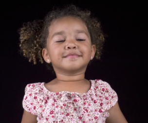 Child taking deep breaths to calm down
